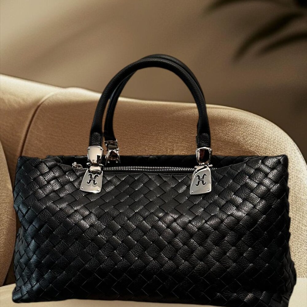 Cole Haan Black Woven Italian leather Handbag with Silver Metal Hardware.